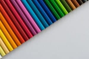 A row of colored pencils sitting next to each other ADHD and OCD