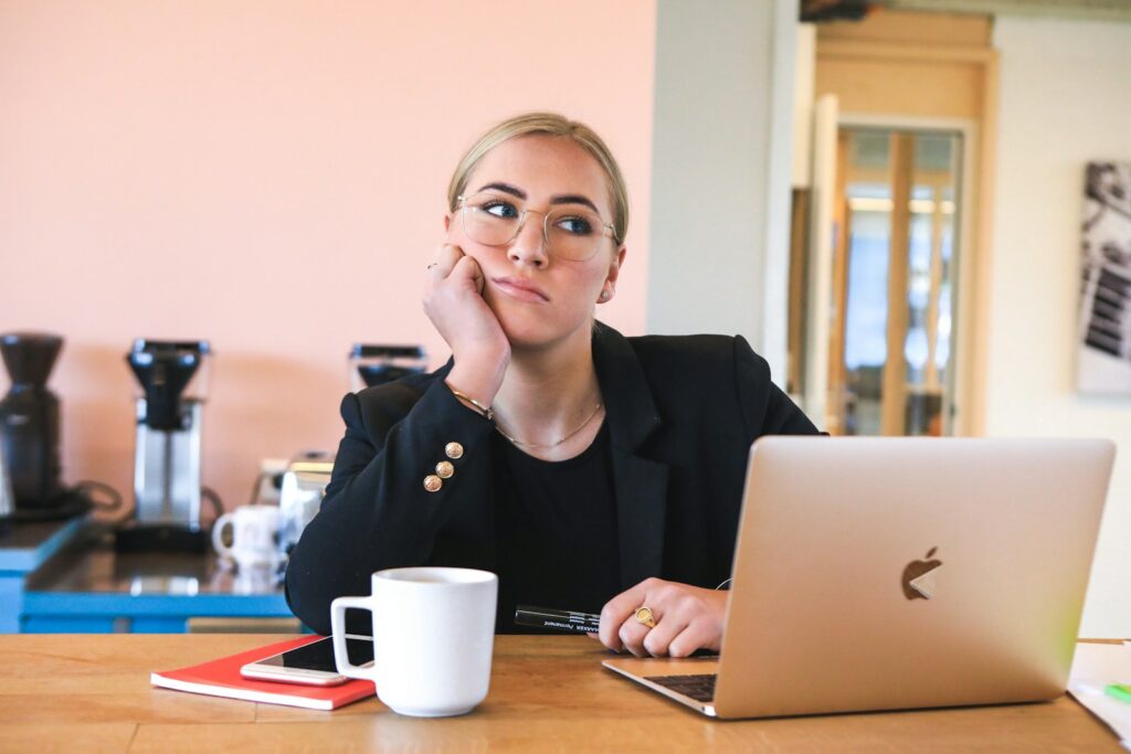 woman in black long sleeve shirt using macbook - worst careers for adhd