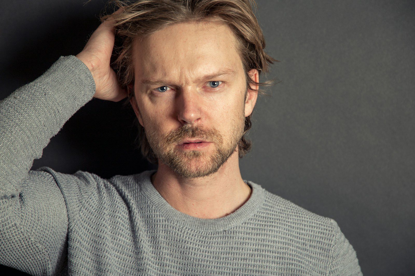 a man with a beard and blue eyes posing for a picture - ADHD Memory