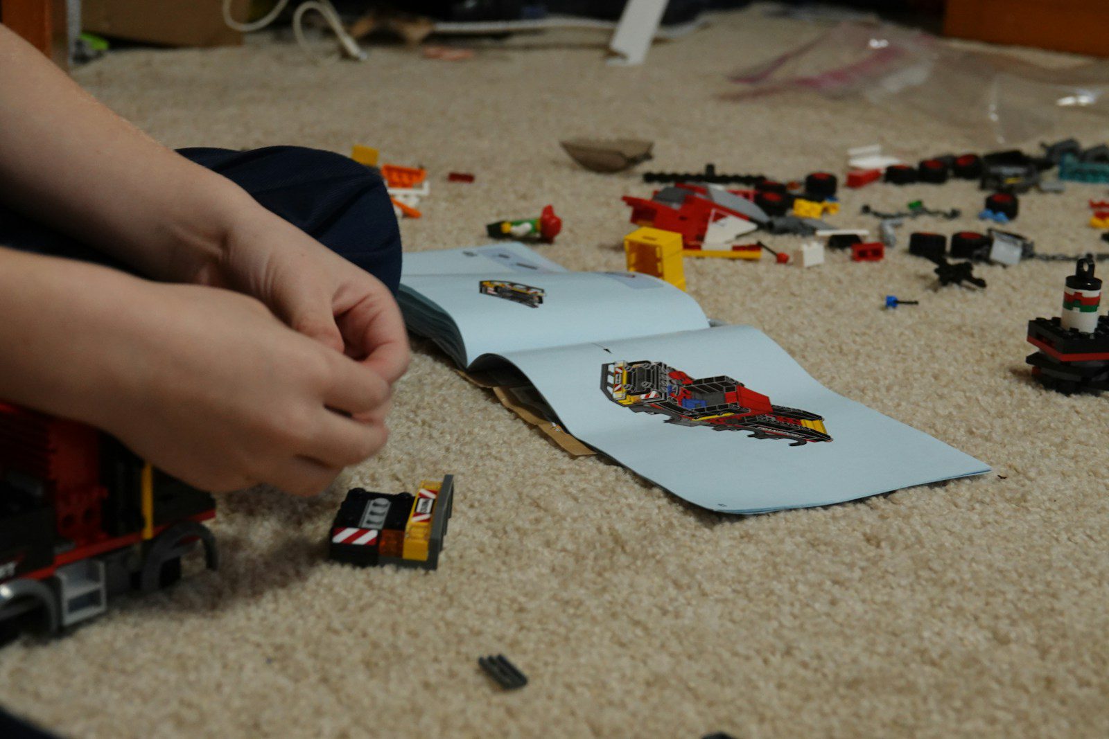 person holding yellow and black car toy - ADHD difficulty following instructions