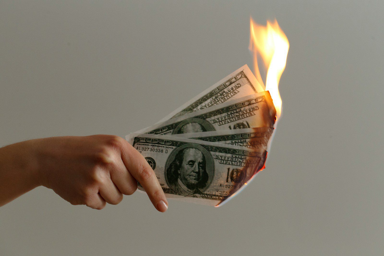 burned 100 US dollar banknotes - adhd money management